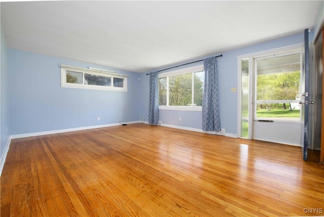 216 Pine Grove St, Syracuse, NY 13210 - unfurnished room featuring baseboards and light wood-style floors