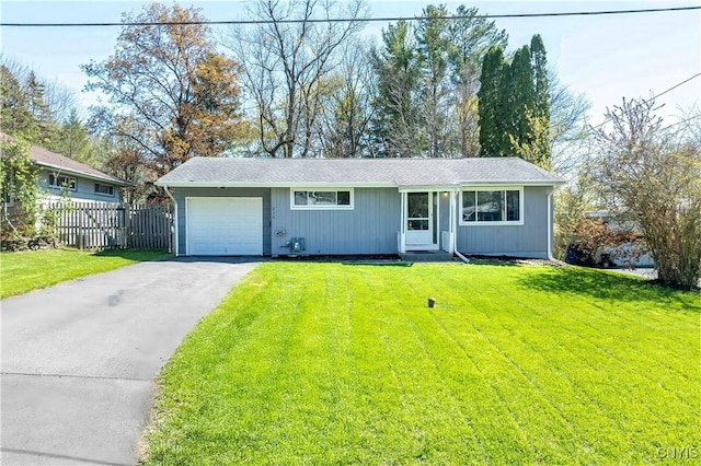 216 Pine Grove St, Syracuse, NY 13210 - ranch-style house featuring an attached garage, a front lawn, fence, and driveway
