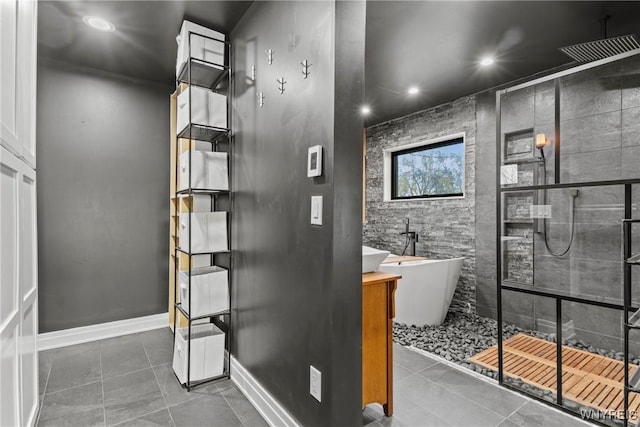 bathroom with recessed lighting, tiled shower, a soaking tub, and tile patterned flooring