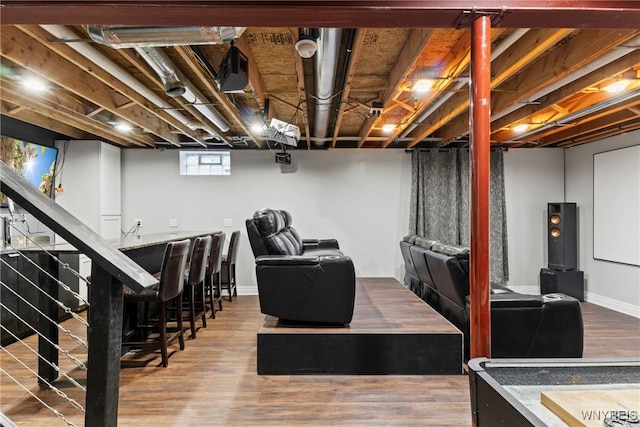 interior space with baseboards and wood finished floors