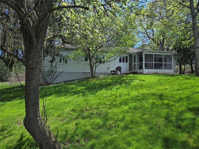 view of yard with a sunroom