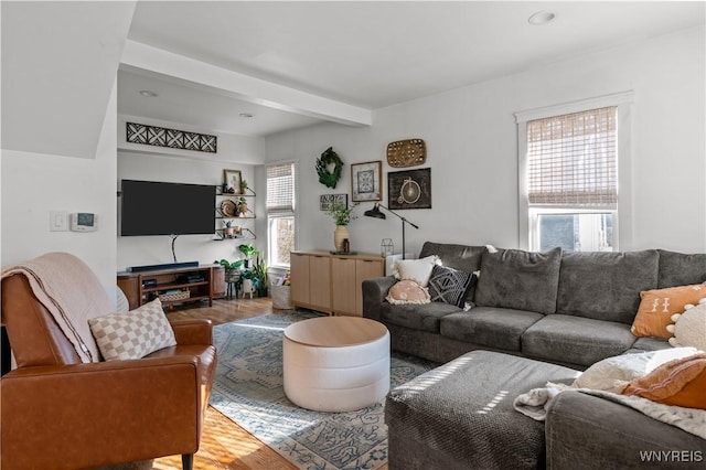 living area featuring recessed lighting, wood finished floors, and beamed ceiling