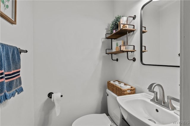 bathroom with a sink and toilet