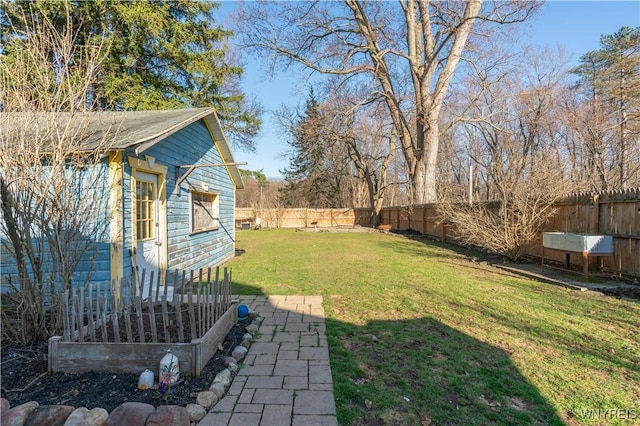 view of yard with a fenced backyard
