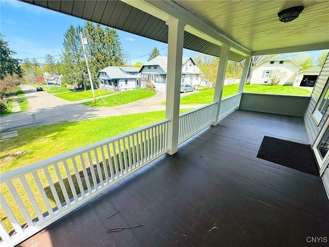 view of patio featuring covered porch and a residential view