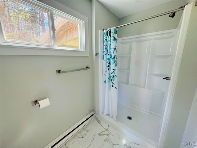 bathroom featuring a stall shower and marble finish floor