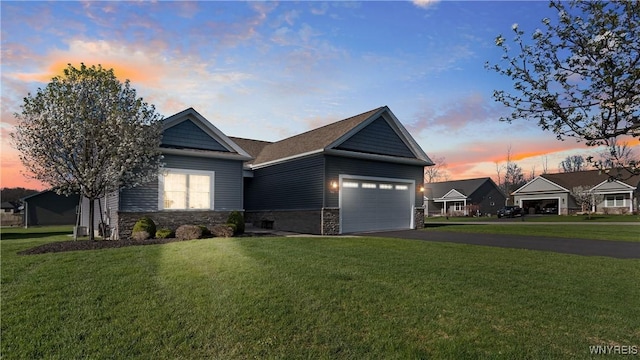 ranch-style house with a garage, a front lawn, aphalt driveway, and stone siding