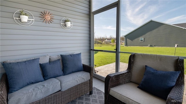 sunroom featuring an outdoor living space