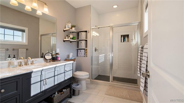 full bath with vanity, toilet, tile patterned flooring, and a stall shower