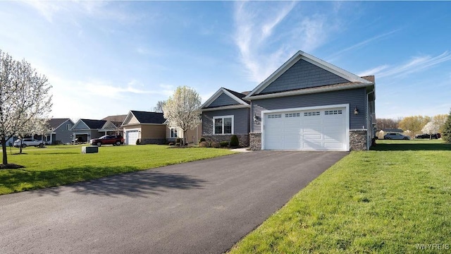 craftsman house with an attached garage, driveway, stone siding, and a front lawn
