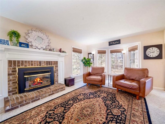 carpeted living room with baseboards and a brick fireplace