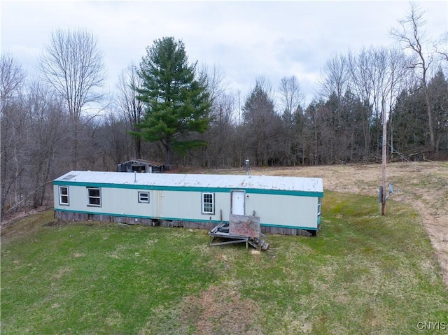 364 W End Rd, Fairfield, NY 13365 - rear view of house featuring a lawn and a view of trees