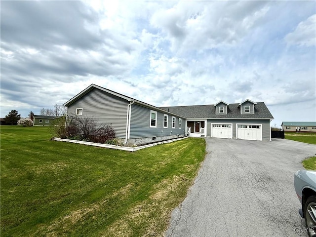 28053 Boat Launch Rd, Lyme, NY 13622 - ranch-style house featuring aphalt driveway, a front lawn, and a garage