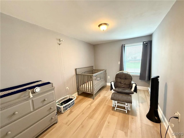 28053 Boat Launch Rd, Lyme, NY 13622 - bedroom with baseboards and light wood-style floors