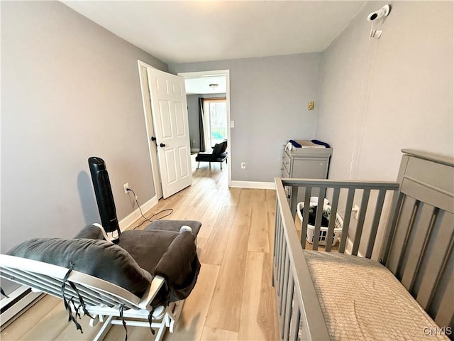 28053 Boat Launch Rd, Lyme, NY 13622 - bedroom featuring baseboards and light wood-style flooring