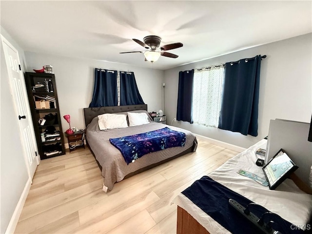 28053 Boat Launch Rd, Lyme, NY 13622 - bedroom featuring light wood-style floors, baseboards, and ceiling fan