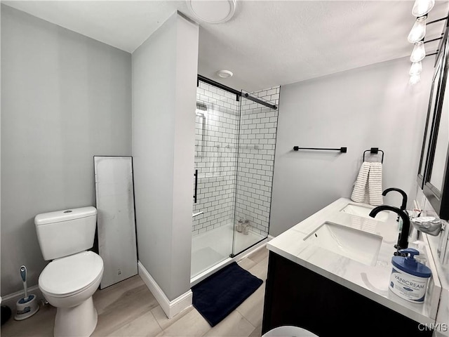 28053 Boat Launch Rd, Lyme, NY 13622 - bathroom featuring double vanity, toilet, a sink, and a stall shower