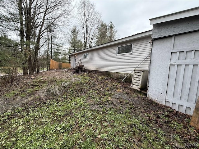 exterior space with fence and ac unit