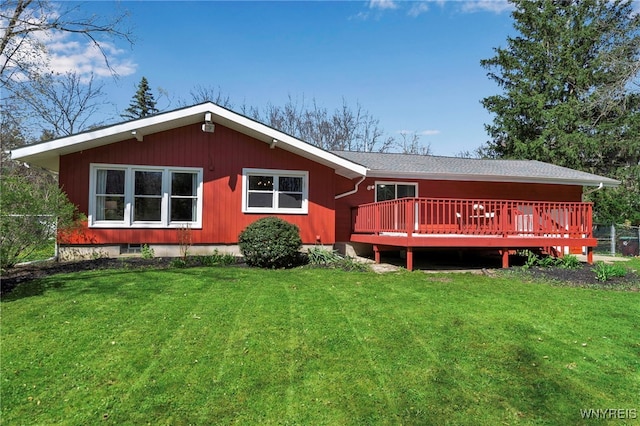 back of house featuring a yard and a deck