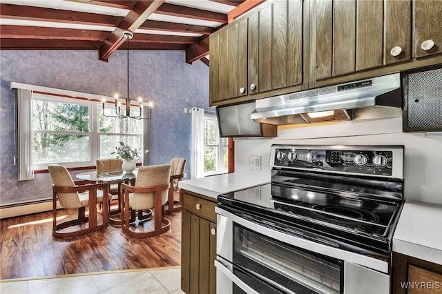 kitchen featuring an inviting chandelier, light countertops, under cabinet range hood, lofted ceiling with beams, and double oven range