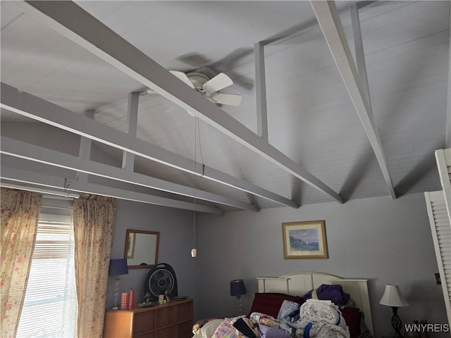 bedroom featuring lofted ceiling with beams