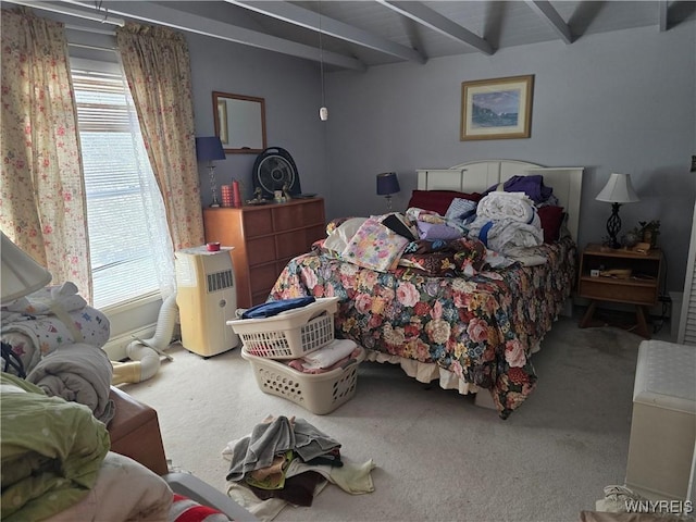 carpeted bedroom featuring beam ceiling