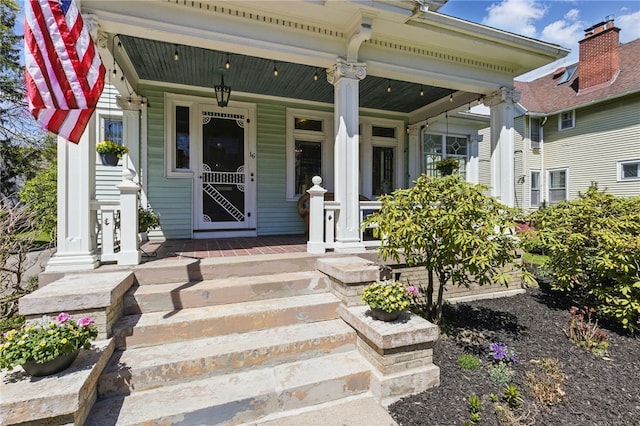 property entrance featuring a porch