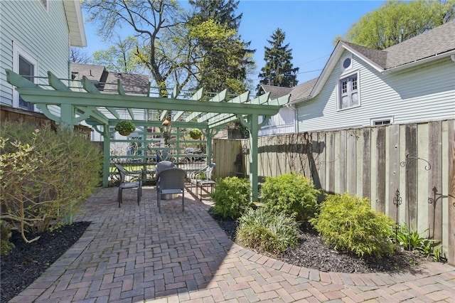 view of patio featuring fence and outdoor dining area