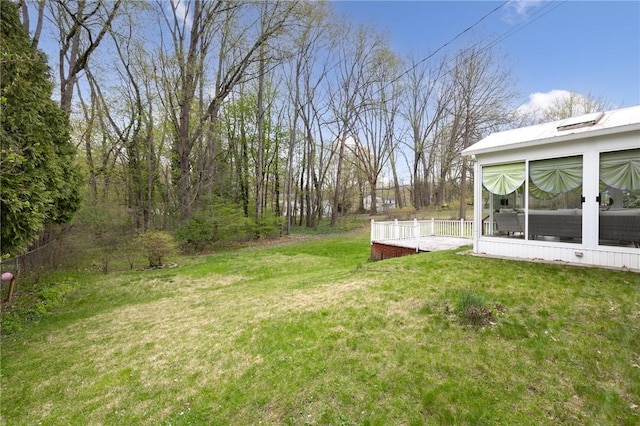 view of yard with a sunroom