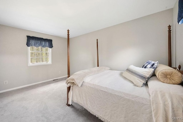 carpeted bedroom featuring baseboards
