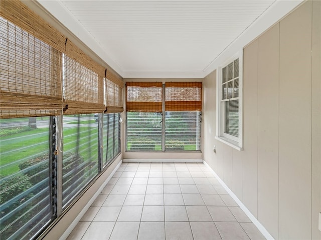 unfurnished sunroom featuring tile patterned flooring