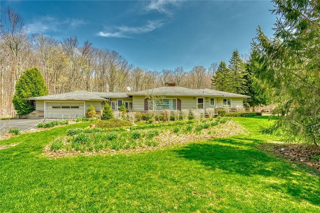 1322 Hatch Rd, Penfield, NY 14580 - single story home with a garage, a chimney, driveway, and a front lawn