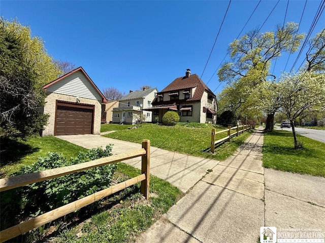 148 Myrtle St, Jamestown, NY 14701 - view of front of house with concrete driveway, fence, and a front yard