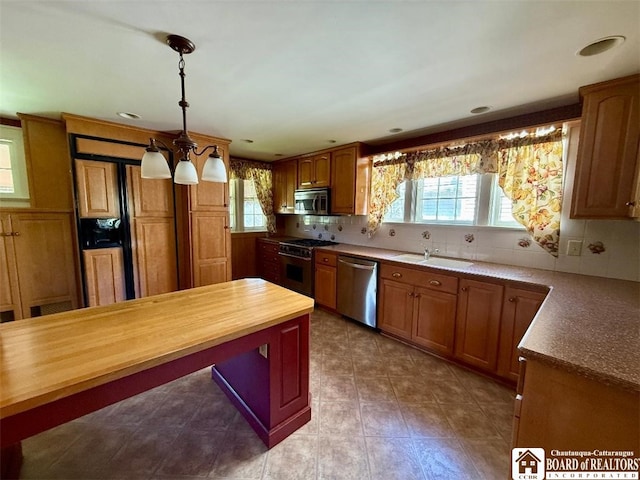 148 Myrtle St, Jamestown, NY 14701 - kitchen featuring decorative backsplash, a sink, wood counters, appliances with stainless steel finishes, and decorative light fixtures