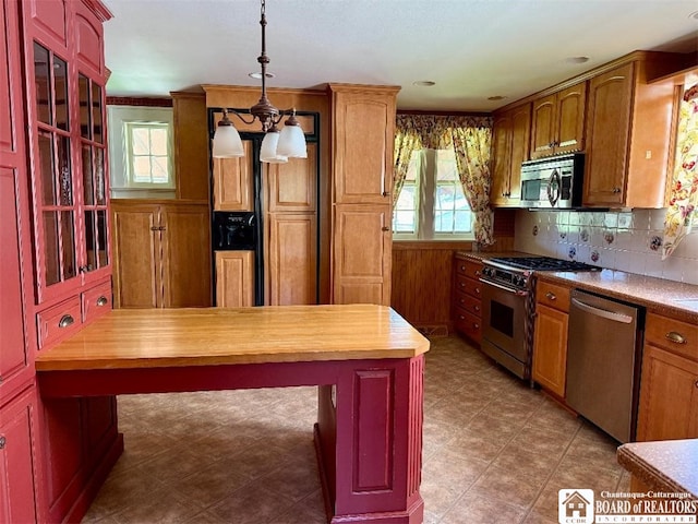 148 Myrtle St, Jamestown, NY 14701 - kitchen with butcher block counters, stainless steel appliances, a chandelier, and a wealth of natural light