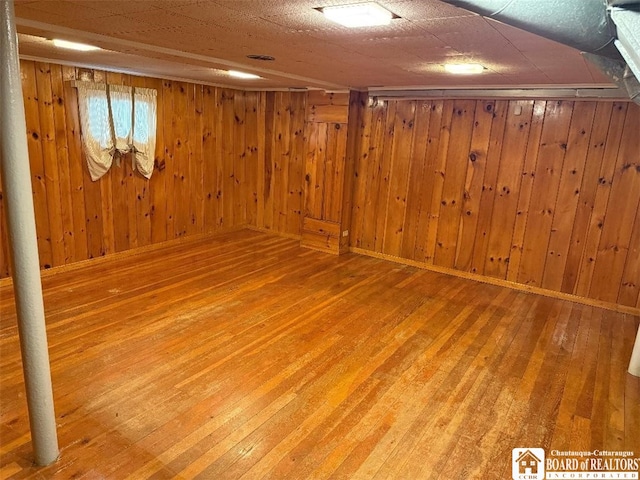 148 Myrtle St, Jamestown, NY 14701 - finished below grade area featuring wood walls and hardwood / wood-style flooring