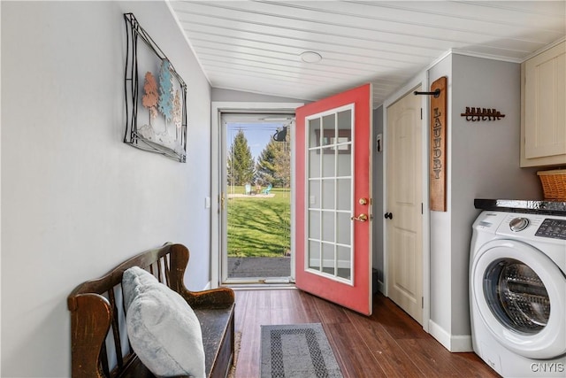 clothes washing area featuring washer / dryer, cabinet space, and wood finished floors