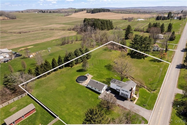 birds eye view of property with a rural view