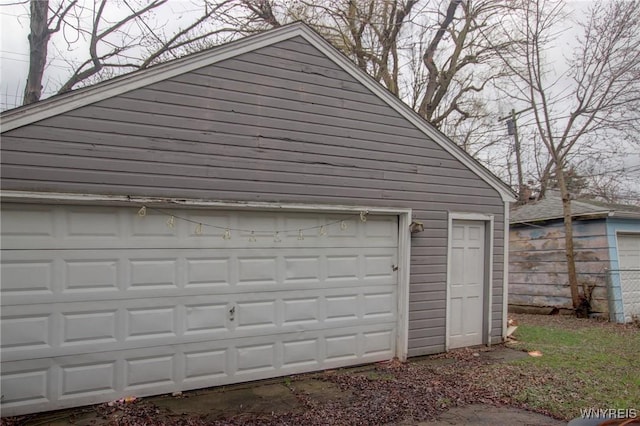 garage featuring fence