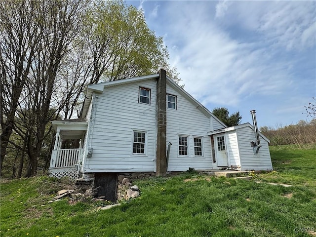 back of property with a yard