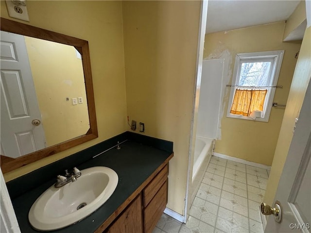 full bathroom with vanity, baseboards, and tile patterned floors