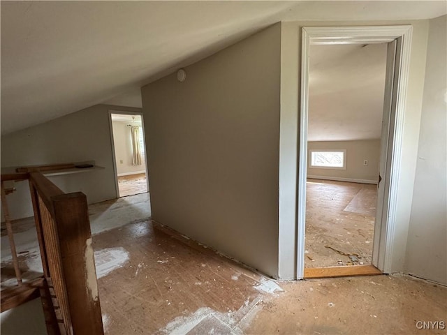 additional living space featuring vaulted ceiling