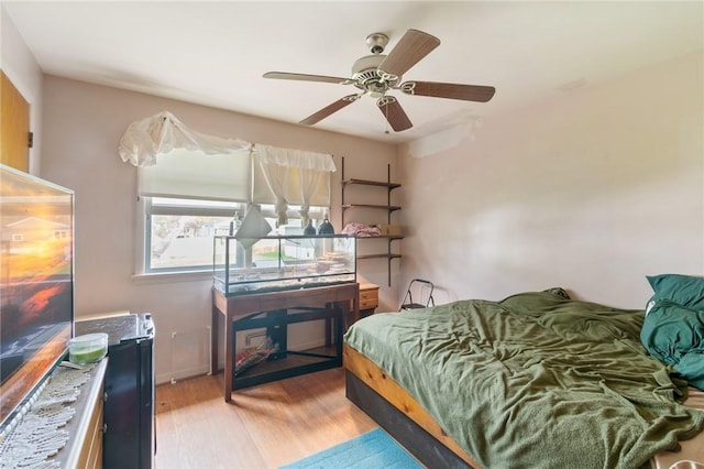 bedroom featuring ceiling fan and wood finished floors