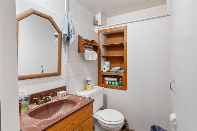 bathroom with toilet and vanity