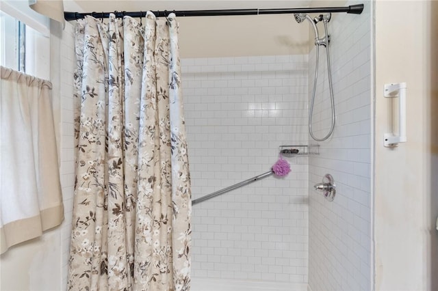 bathroom with a shower stall