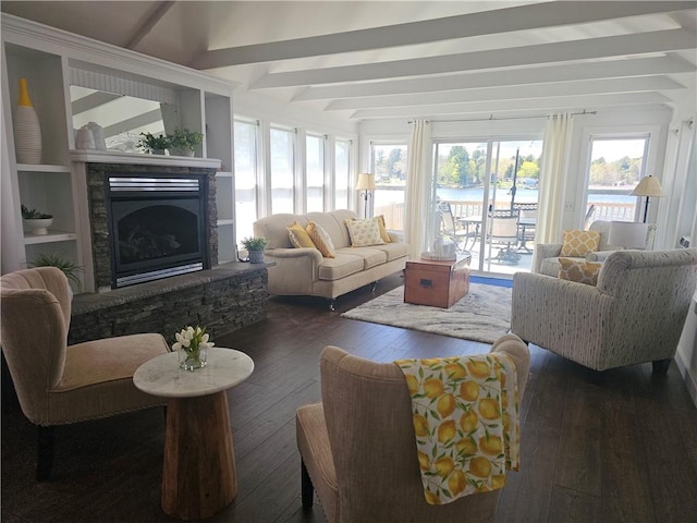 sunroom featuring beamed ceiling