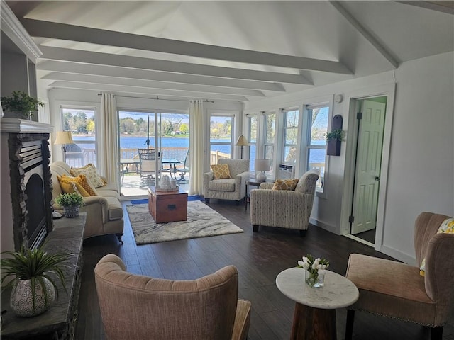 sunroom / solarium with a water view and beamed ceiling