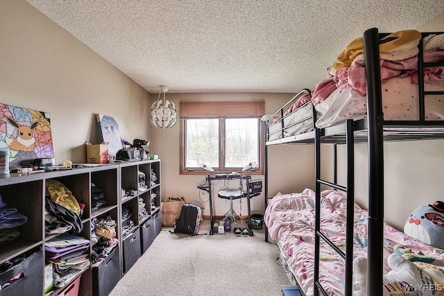 carpeted bedroom featuring a textured ceiling