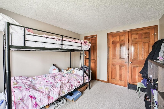 carpeted bedroom featuring a textured ceiling