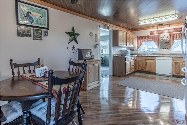 dining area with crown molding, wood ceiling, and a healthy amount of sunlight
